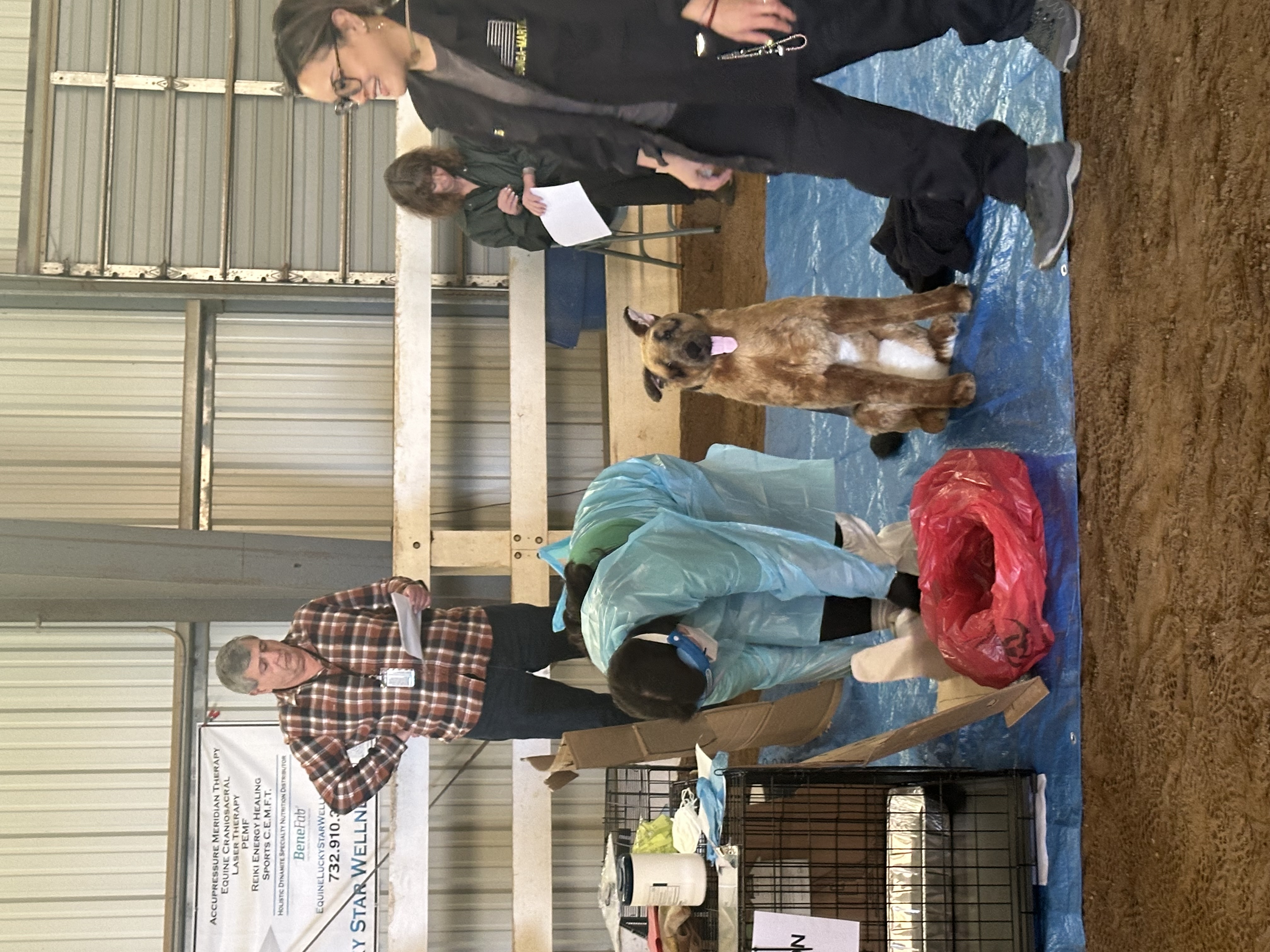participant donning PPE in shelter simulation